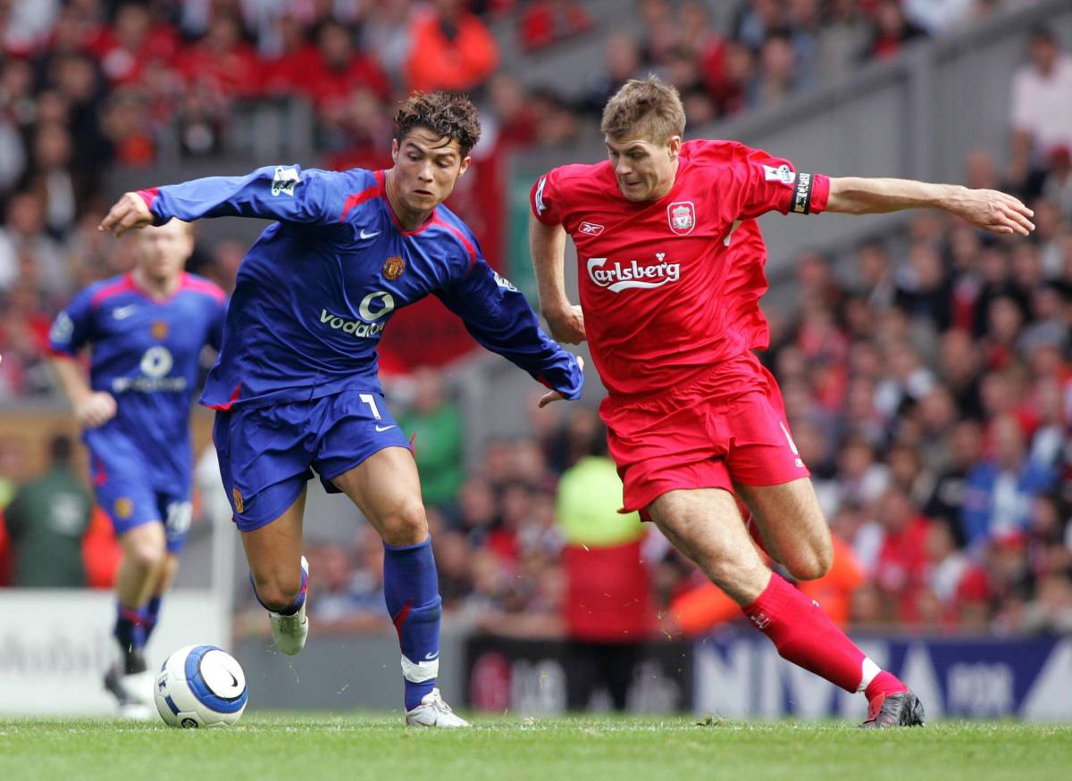Steven Gerrard (right) and Cristiano Ronaldo (left) pictured in battle during a Premier League game between Liverpool and Manchester United in September 2005