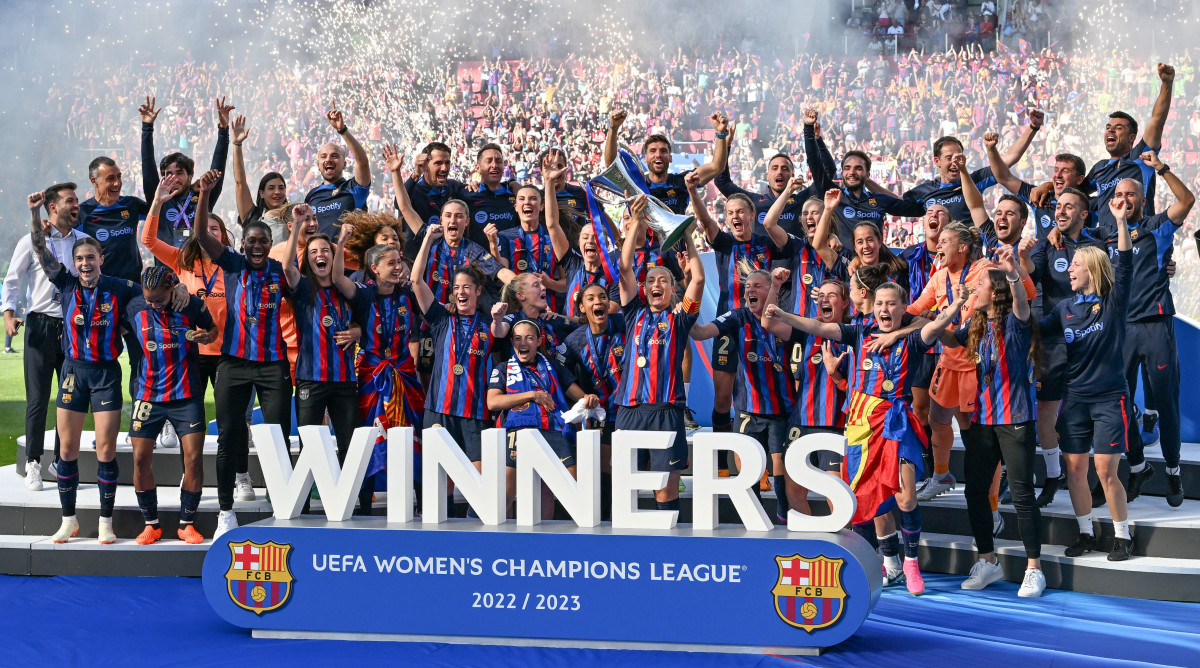 Players of Barcelona celebrate after winning the 2022-23 Women's Champions League final over Wolfsburg.