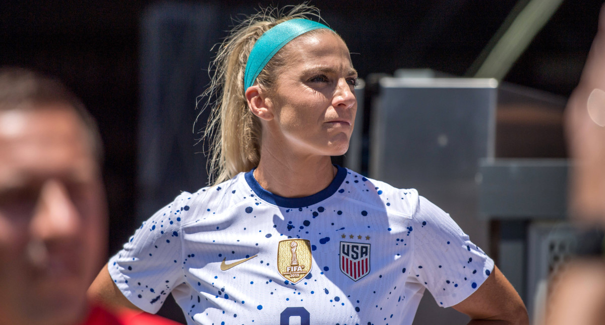 Julie Ertz stands on the sidelines before a game between the United States and Wales.