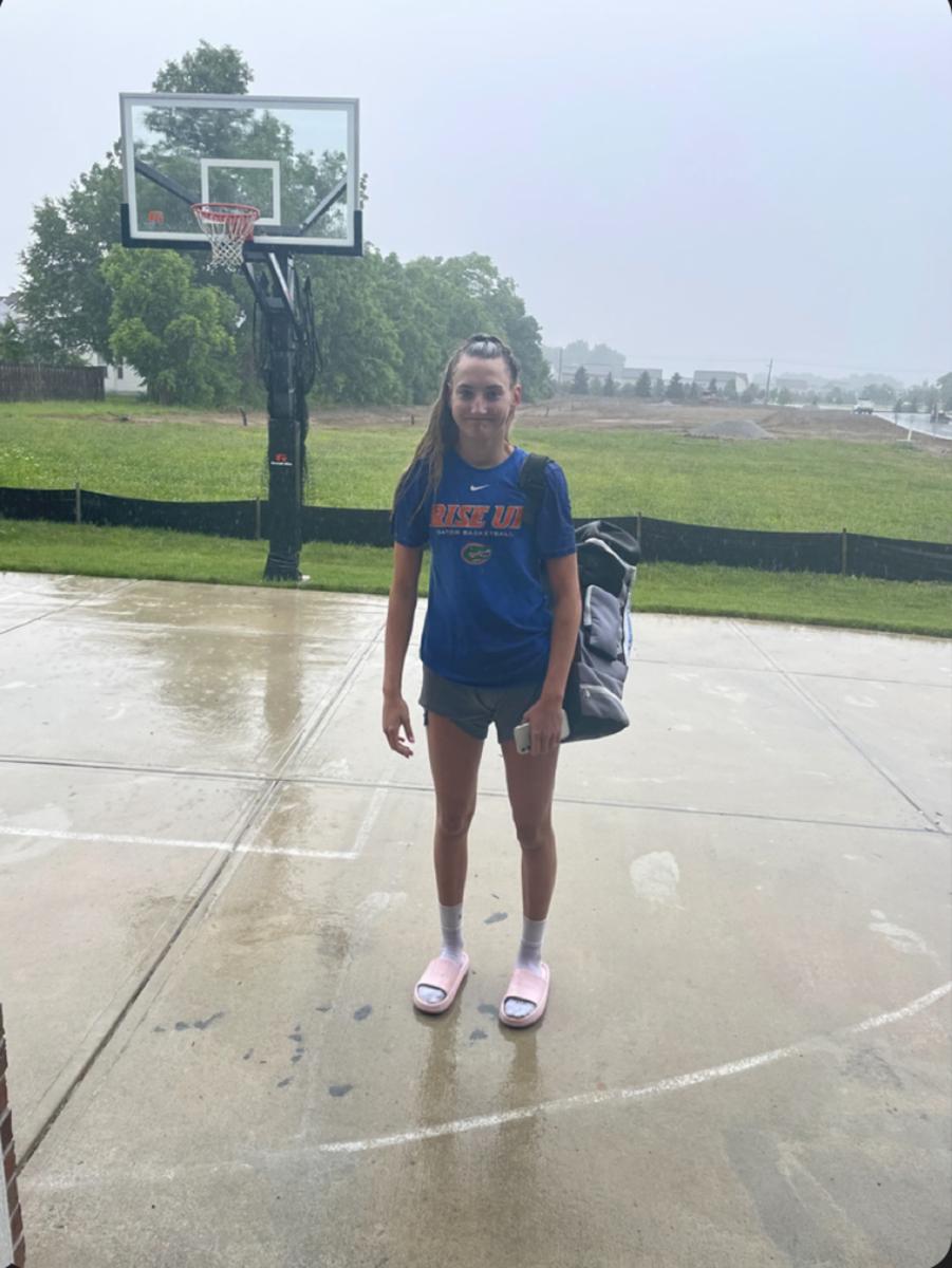 A younger Maya Makalusky returns home from the Hamilton Southeastern gym after riding her bike over in the pouring rain to get shots up after she had been told she needed to take a break from basketball.