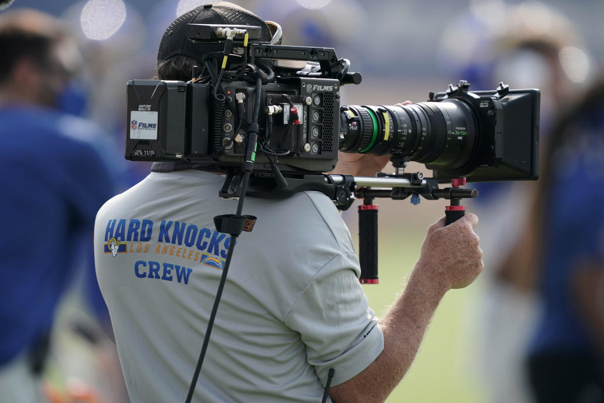 A HBO Hard Knocks cameraman films