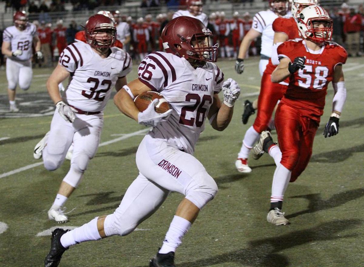 Maple Grove's Evan Hull (26) ran for yardage in a Class 6A second-round game against Lakeville North on Nov. 2.
