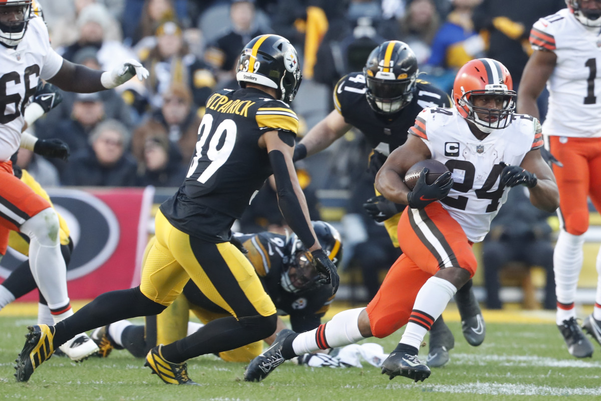 Jan 8, 2023; Pittsburgh, Pennsylvania, USA; Cleveland Browns running back Nick Chubb (24) runs the ball against Pittsburgh Steelers safety Minkah Fitzpatrick (39) during the fourth quarter at Acrisure Stadium. Pittsburgh won 28-14. Mandatory Credit: Charles LeClaire-USA TODAY Sports