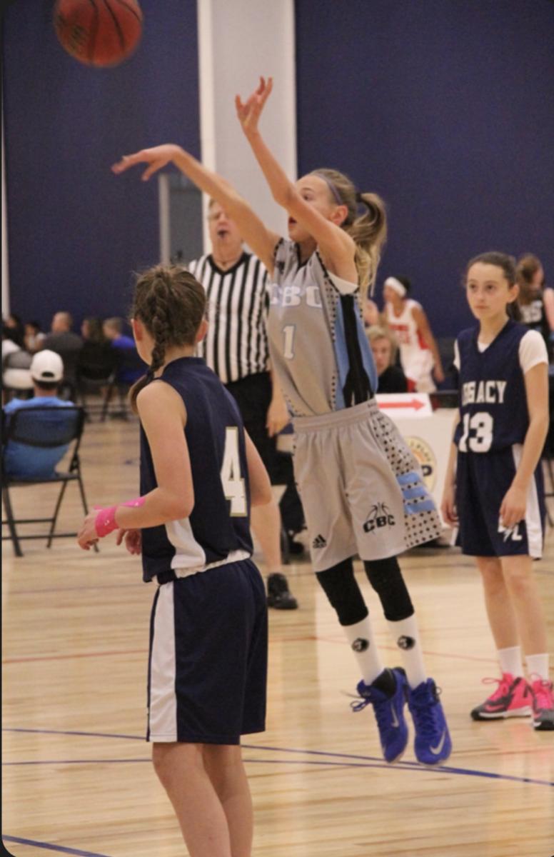 A younger Maya Makalusky shooting a jumper back during her first AAU travel basketball game in Colorado. 