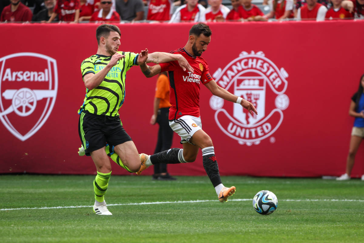 Bruno Fernandes (right) and Declan Rice (left) pictured in action during a pre-season game between Manchester United and Arsenal at New Jersey's MetLife Stadium in July 2023