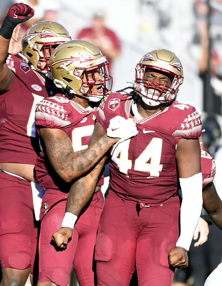 Oct 1, 2022; Tallahassee, Florida, USA; Florida State Seminoles defensive end Patrick Payton (56) celebrates a sack with defensive tackle Joshua Farmer (44) during the second half against the Wake Forest Demon Deacons at Doak S. Campbell Stadium.
