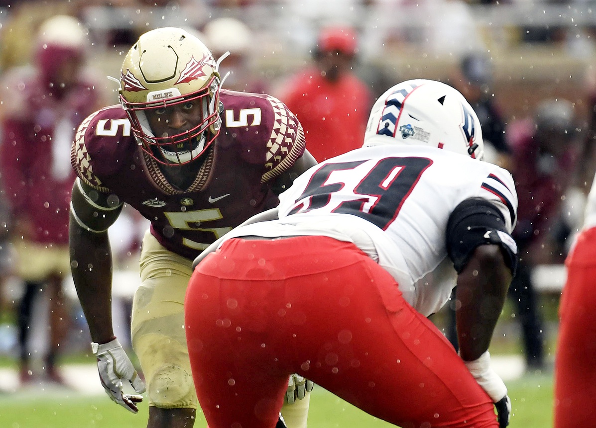 Florida State Seminoles defensive end Jared Verse (5) lines up against Duquesne Dukes offensive lineman Chris Oliver (59) during the first half at Doak S. Campbell Stadium.