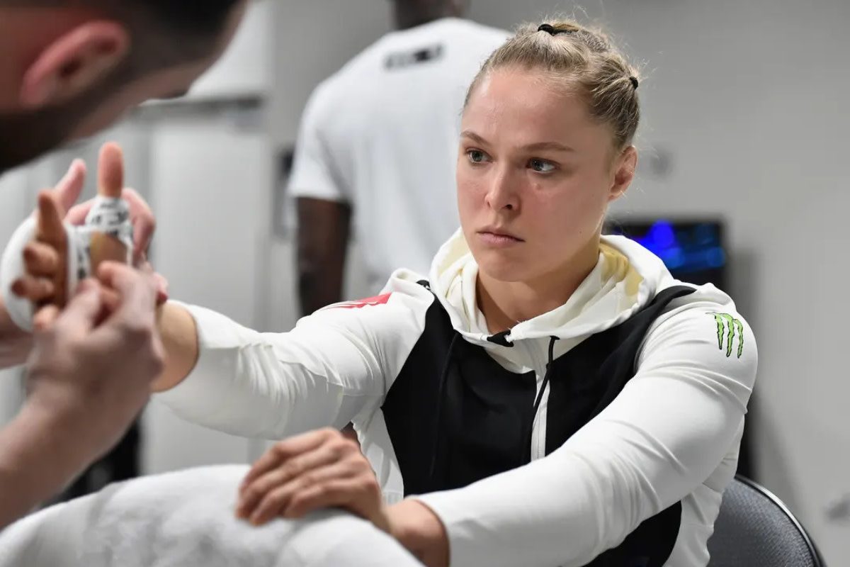 Ronda Rousey getting her hands wrapped before a UFC fight.