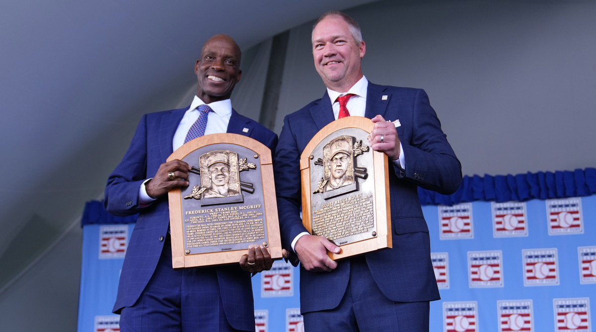 Fred McGriff and Scott Rolen stand side by side holding their Hall of Fame plaques
