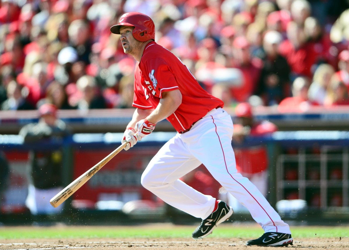 Scott Rolen looks out after hitting the ball, dropping his bat toward the dirt
