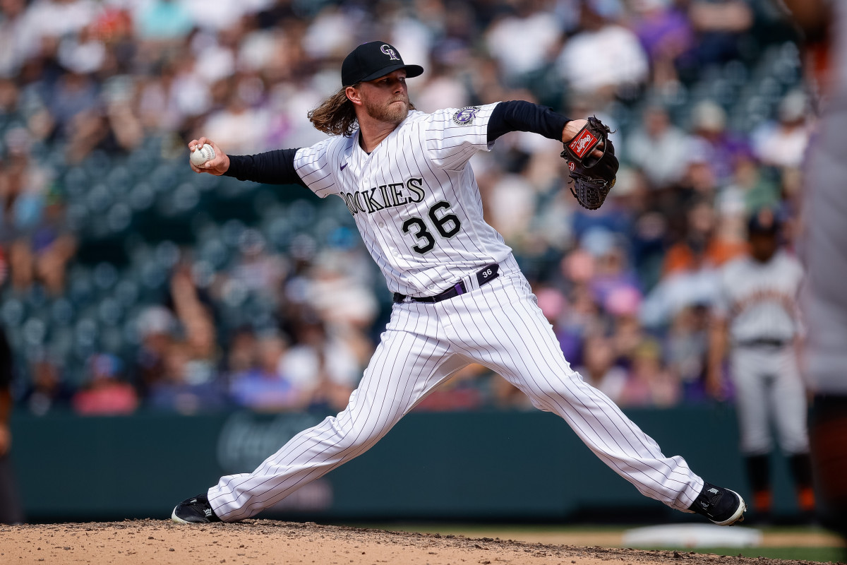 Pierce Johnson slings his arm back to throw a pitch