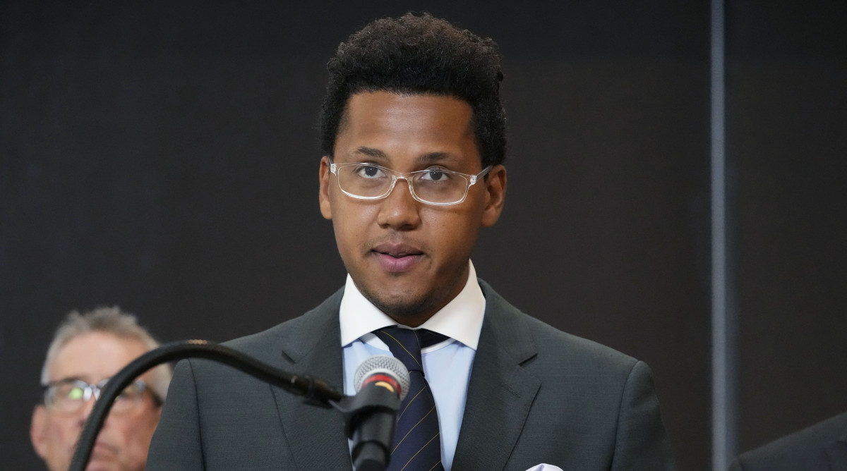 Former Northwestern quarterback Lloyd Yates speaks at a news conference about the hazing lawsuits facing the school.