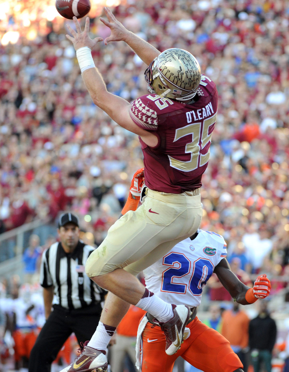 Nov 29, 2014; Tallahassee, FL, USA; Florida State Seminoles tight end Nick O'Leary (35) catches a touchdown pass past Florida Gators defensive back Marcus Maye (20) during the first half at Doak Campbell Stadium