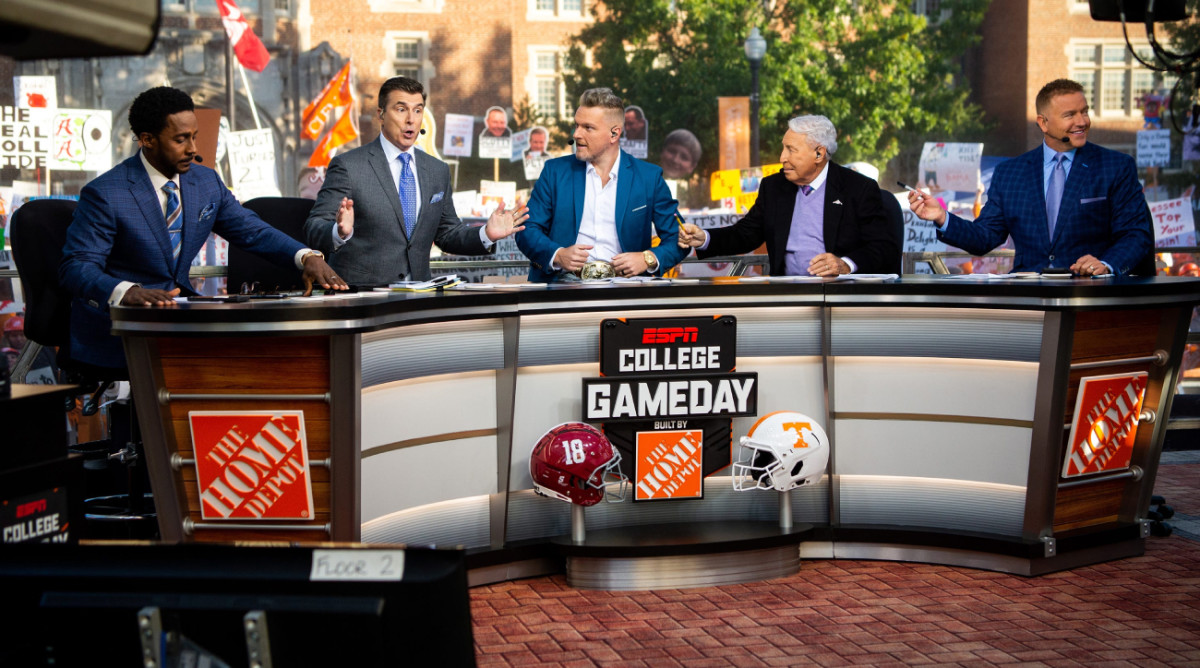 Desmond Howard, Rece Davis, Pat McAfee, Lee Corso and Kirk Herbstreit sit at the ESPN College GameDay table.