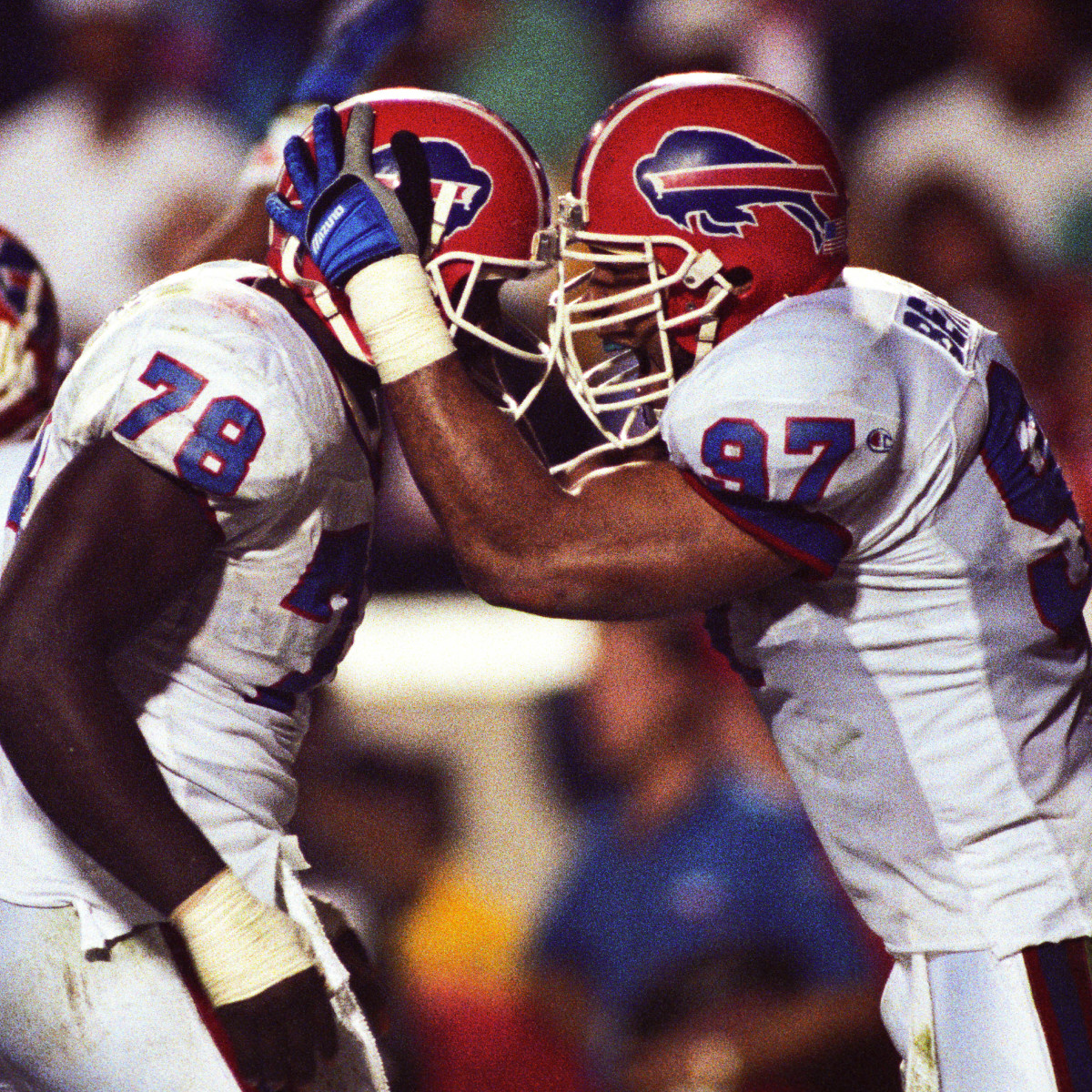 Buffalo Bills defensive end Bruce Smith (78) and linebacker Cornelius Bennett (97) react on the field during Super Bowl XXV against the New York Giants at Tampa Stadium. The Giants defeated the Bills 19-20.