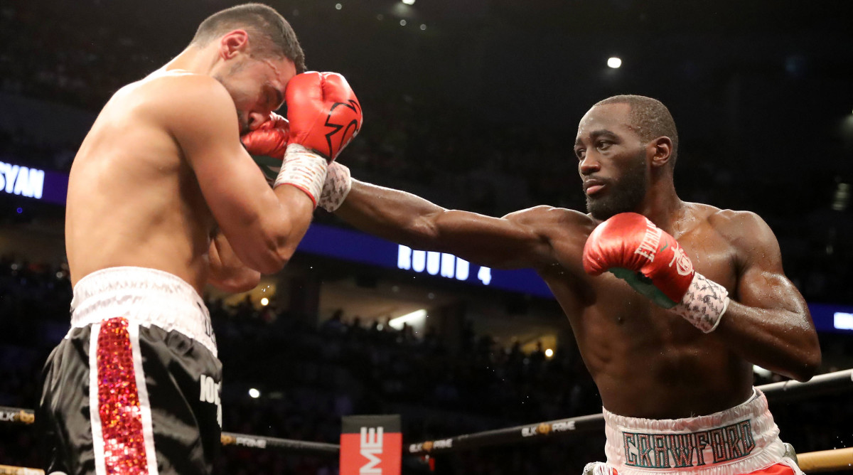 Terence Crawford punches David Avanesyan in a fight for WBO welterweight champion.