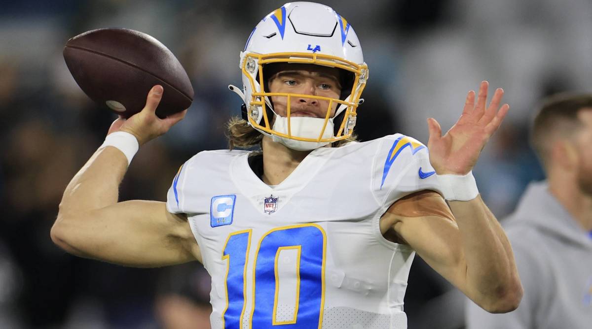 Chargers quarterback Justin Herbert throws a pass in warmups before a game.