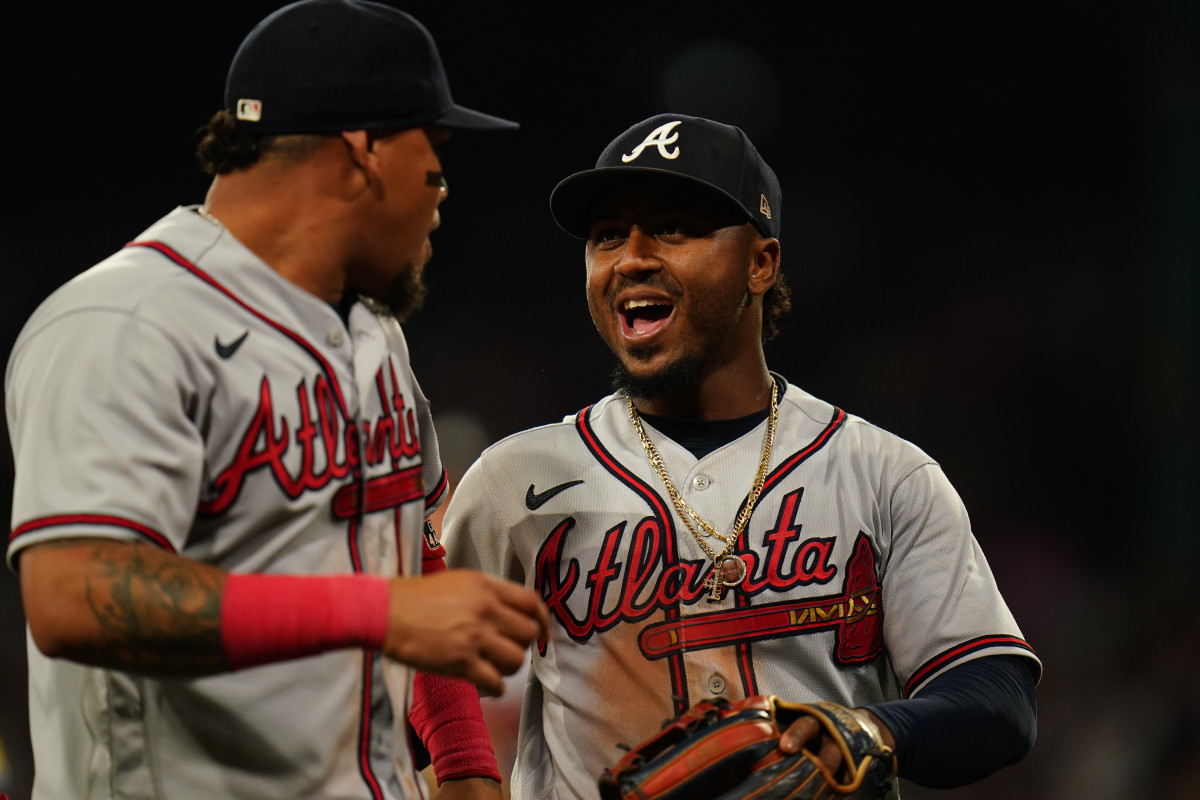 Jul 25, 2023; Boston, Massachusetts, USA; Atlanta Braves second baseman Ozzie Albies (1) (right) reacts with shortstop Orlando Arcia (11) after a triple play against the Boston Red Sox in the third inning at Fenway Park.
