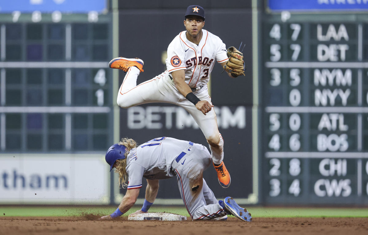 Texas Rangers left fielder Travis Jankowski is out at second base as Houston Astros shortstop Jeremy Pena throws to first base in the sixth inning Tuesday at Minute Maid Park.