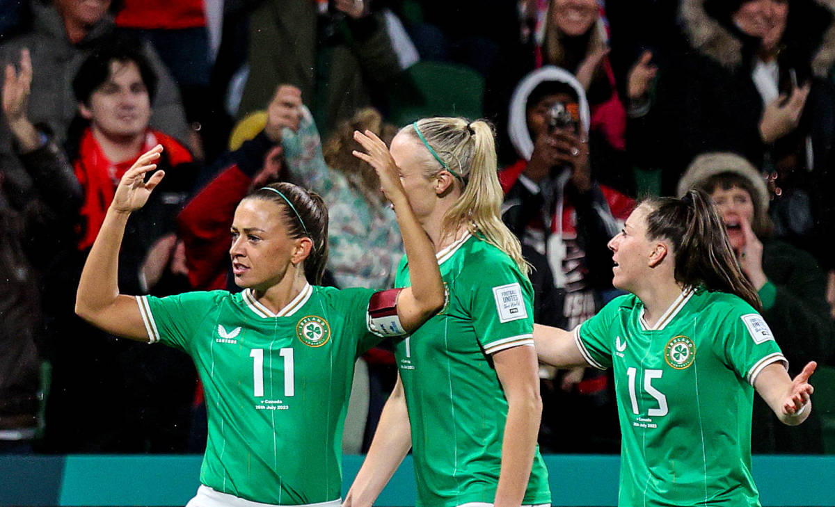 Ireland captain Katie McCabe pictured (left) after scoring her country's first ever goal at a Women's World Cup in July 2023
