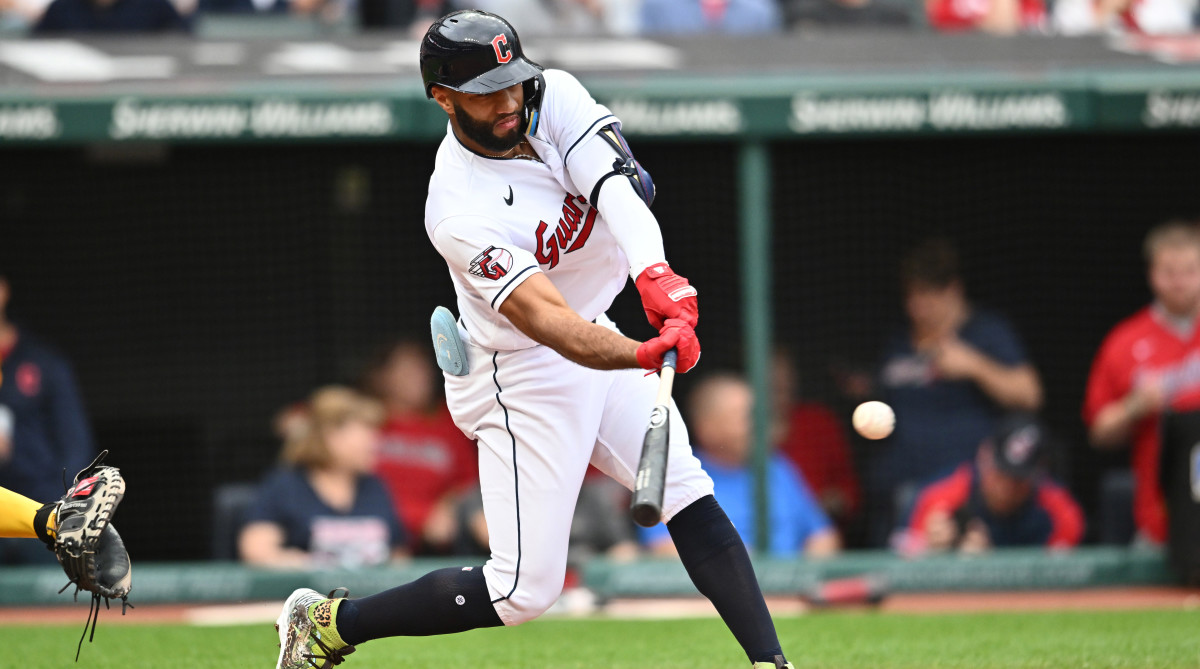 Guardians shortstop Amed Rosario hits a single during the first inning against the Brewers.