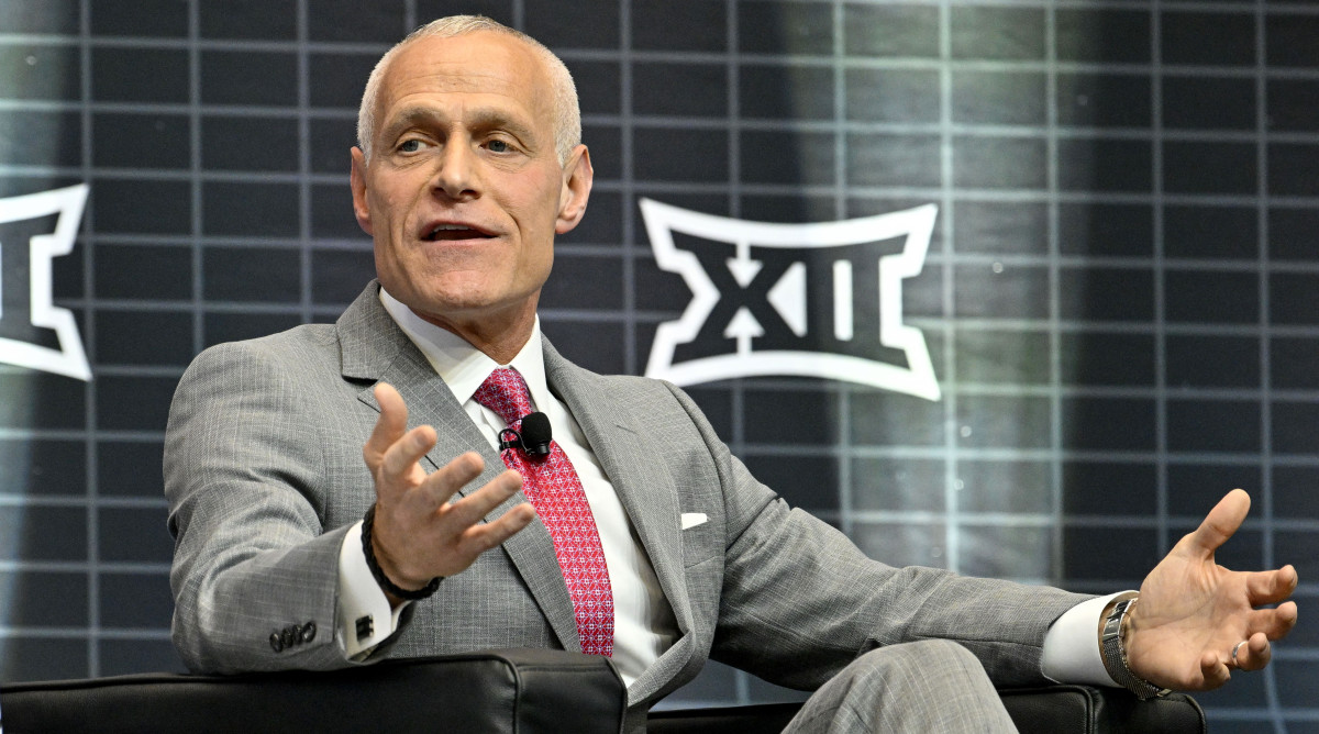 Big 12 commissioner Brett Yormark sits while speaking to press at Big 12 football media days.
