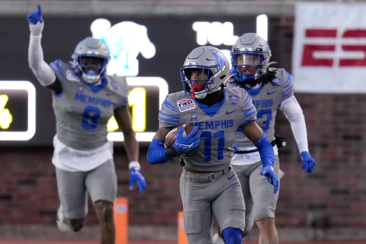Dec 27, 2022; Dallas, Texas, USA; Memphis Tigers defensive back Sylvonta Oliver (11) catches his 2nd interception of the game against the Utah State Aggies during the second half in the 2022 First Responder Bowl at Gerald J. Ford Stadium. Mandatory Credit: Chris Jones-USA TODAY Sports