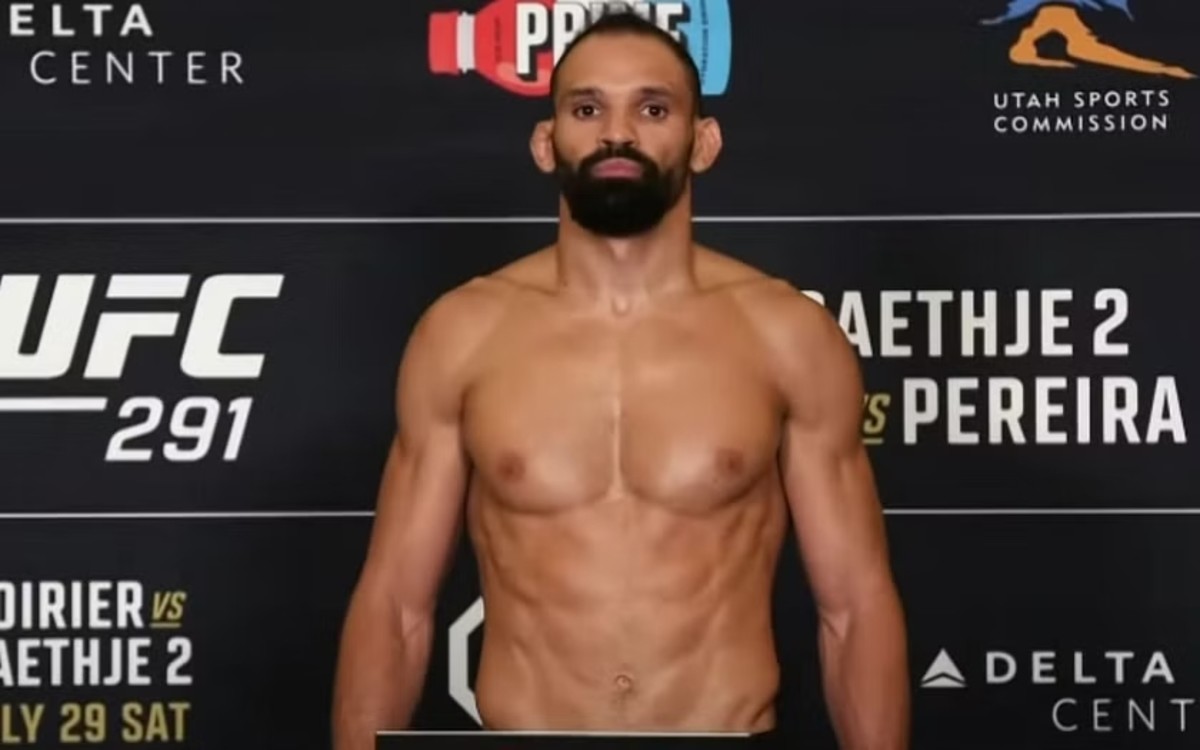 Alex Pereira whiffs on the scale during the UFC 291 weigh-ins.