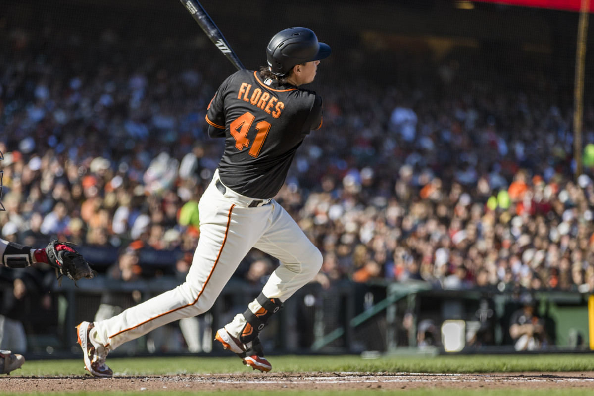 SF Giants first baseman Wilmer Flores hits a single against the Boston Red Sox during the third inning at Oracle Park on July 29, 2023.