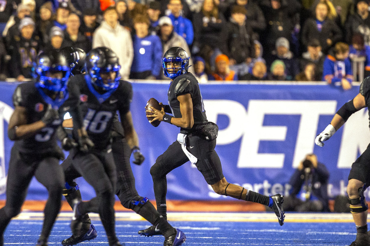 Nov 5, 2022; Boise, Idaho, USA; Boise State Broncos quarterback Taylen Green (10) rolls out to pass against the Brigham Young Cougarsduring the second half at Albertsons Stadium. Brigham Young won 31-28. Mandatory Credit: Brian Losness-USA TODAY Sports