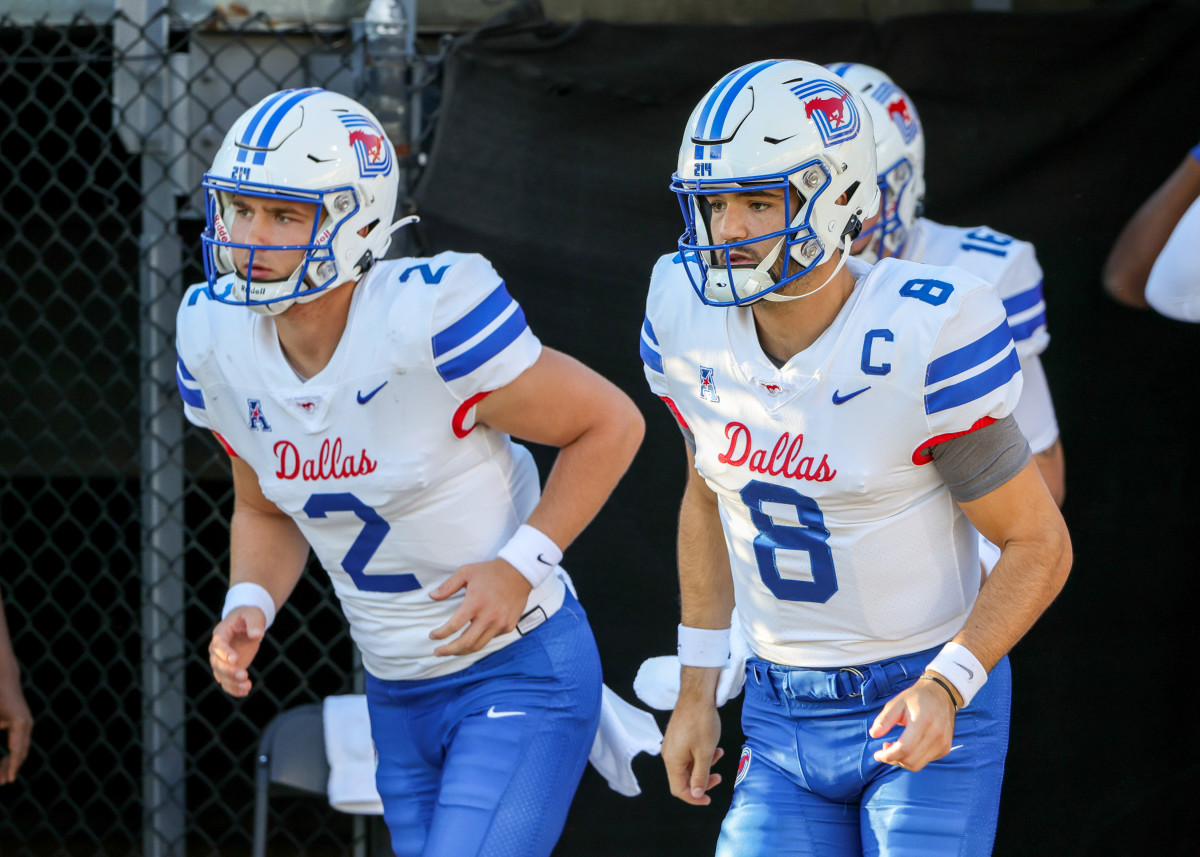 Oct 5, 2022; Orlando, Florida, USA; Southern Methodist Mustangs quarterback Tanner Mordecai (8) and quarterback Preston Stone (2) take the field before a game against the UCF Knights at FBC Mortgage Stadium. Mandatory Credit: Mike Watters-USA TODAY Sports