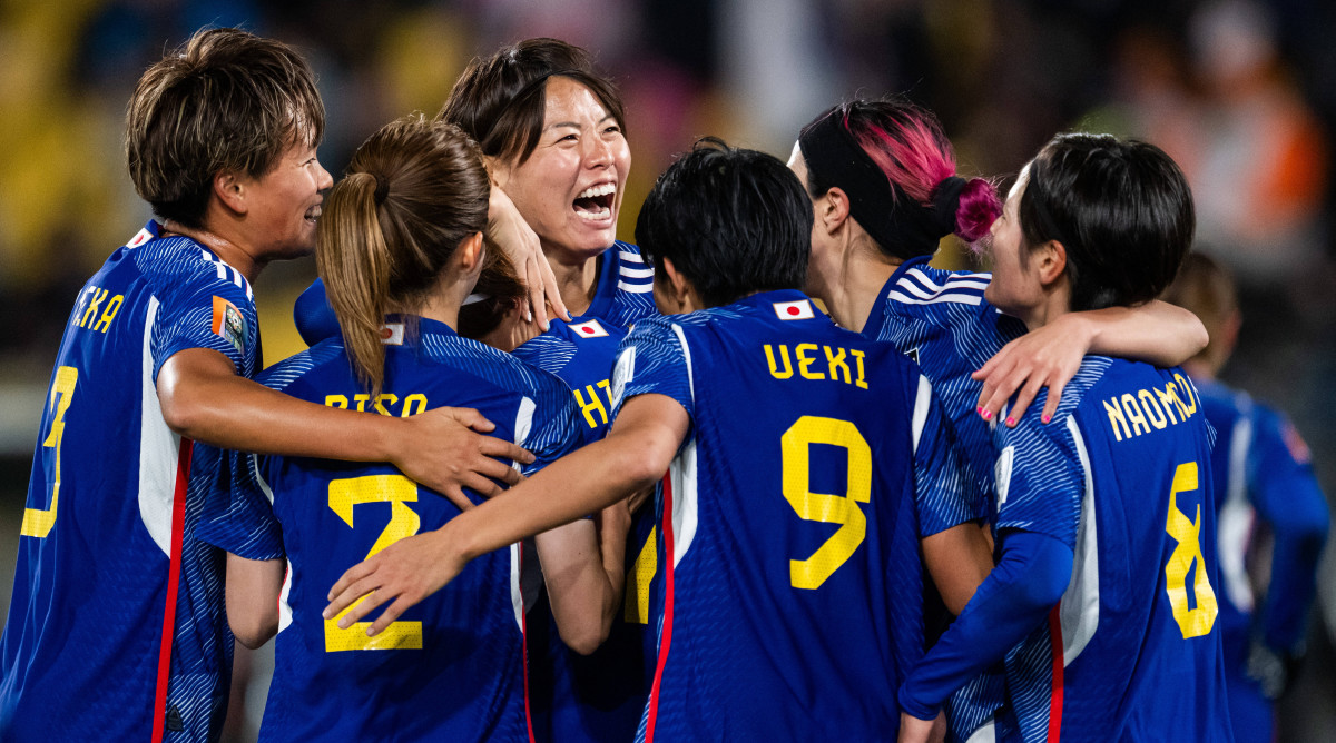 Hinata Miyazawa of Japan celebrates with team mates after vs. Spain during the Women's World Cup.