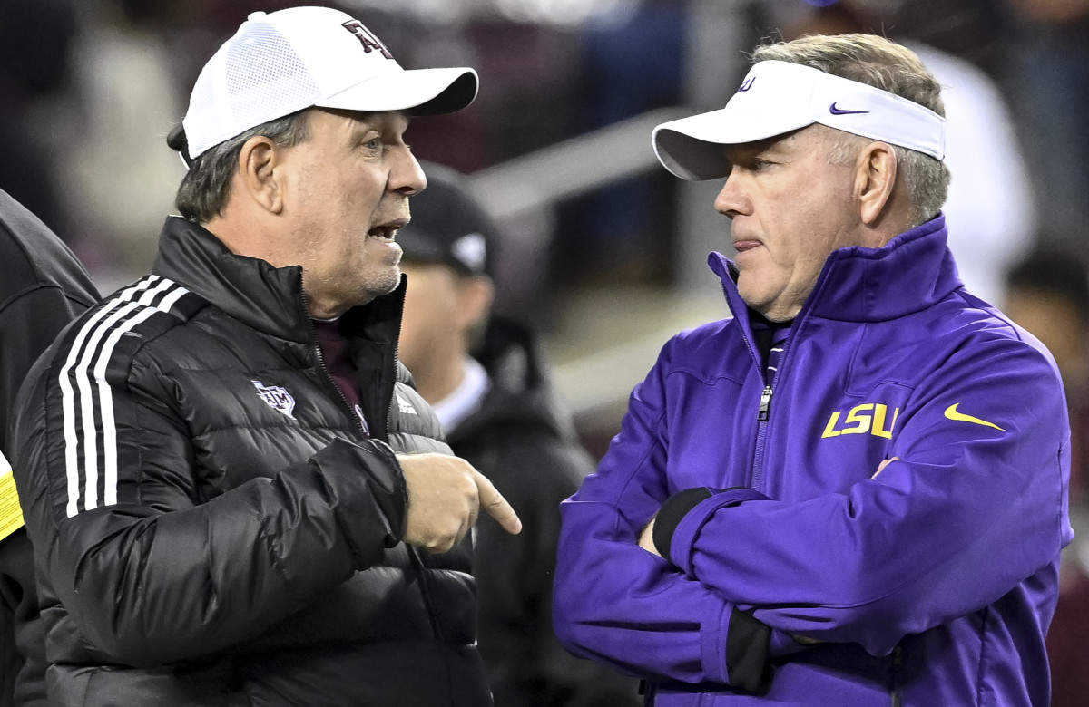 LSU coach Brian Kelly and Texas A&M Aggies coach Jimbo Fisher talk prior to a game at Kyle Field.
