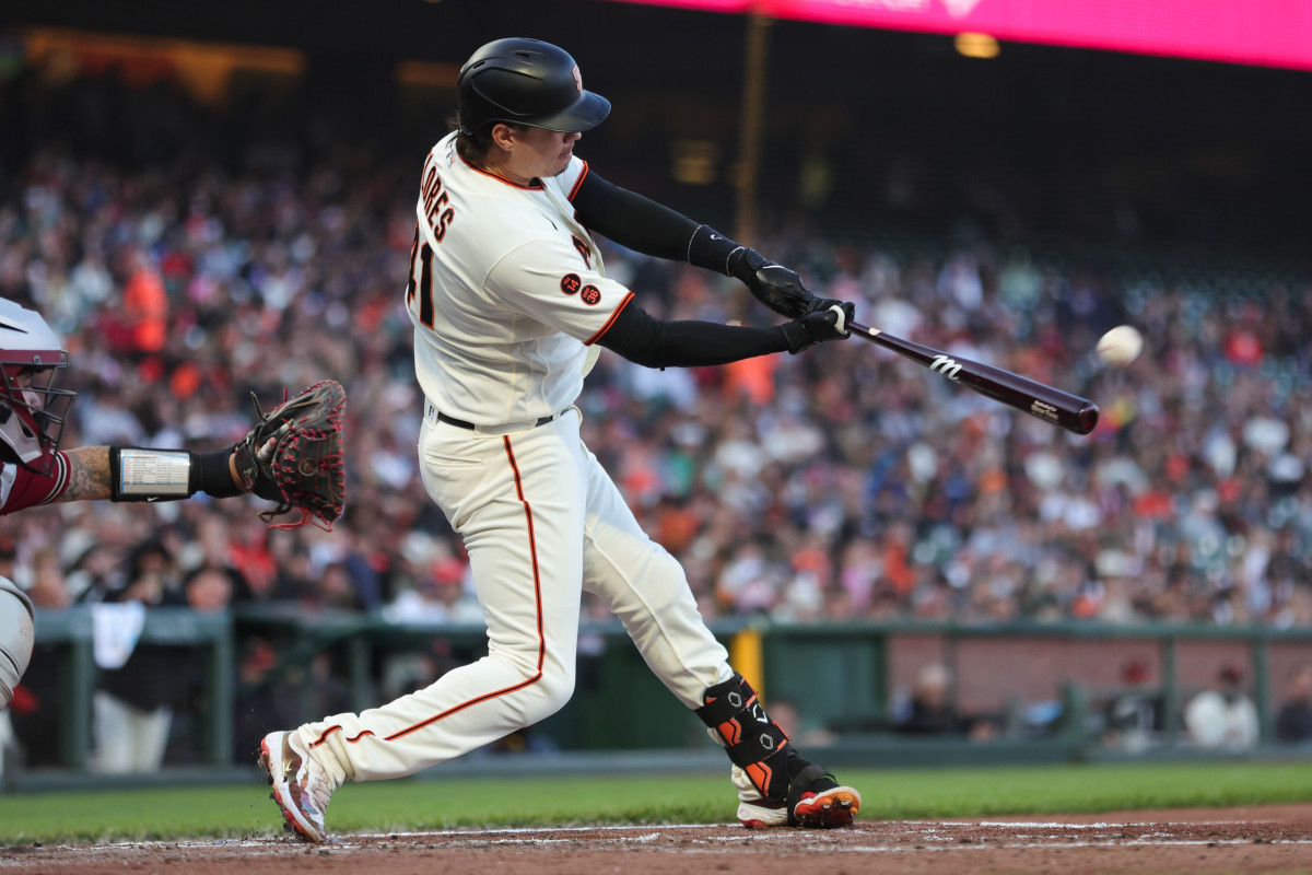 SF Giants first baseman Wilmer Flores hits a solo home run during the third inning against the Arizona Diamondbacks on July 31, 2023.