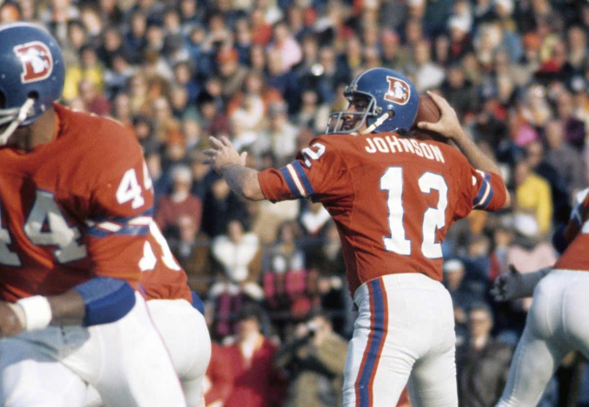 Denver Broncos quarterback Charley Johnson (12) in action against the Kansas City Chiefs at Mile High Stadium.