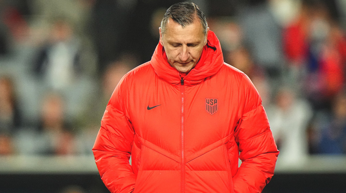 USWNT coach Vlatko Andonovski looks at the ground as his sides struggles against Portugal at the Women's World Cup.