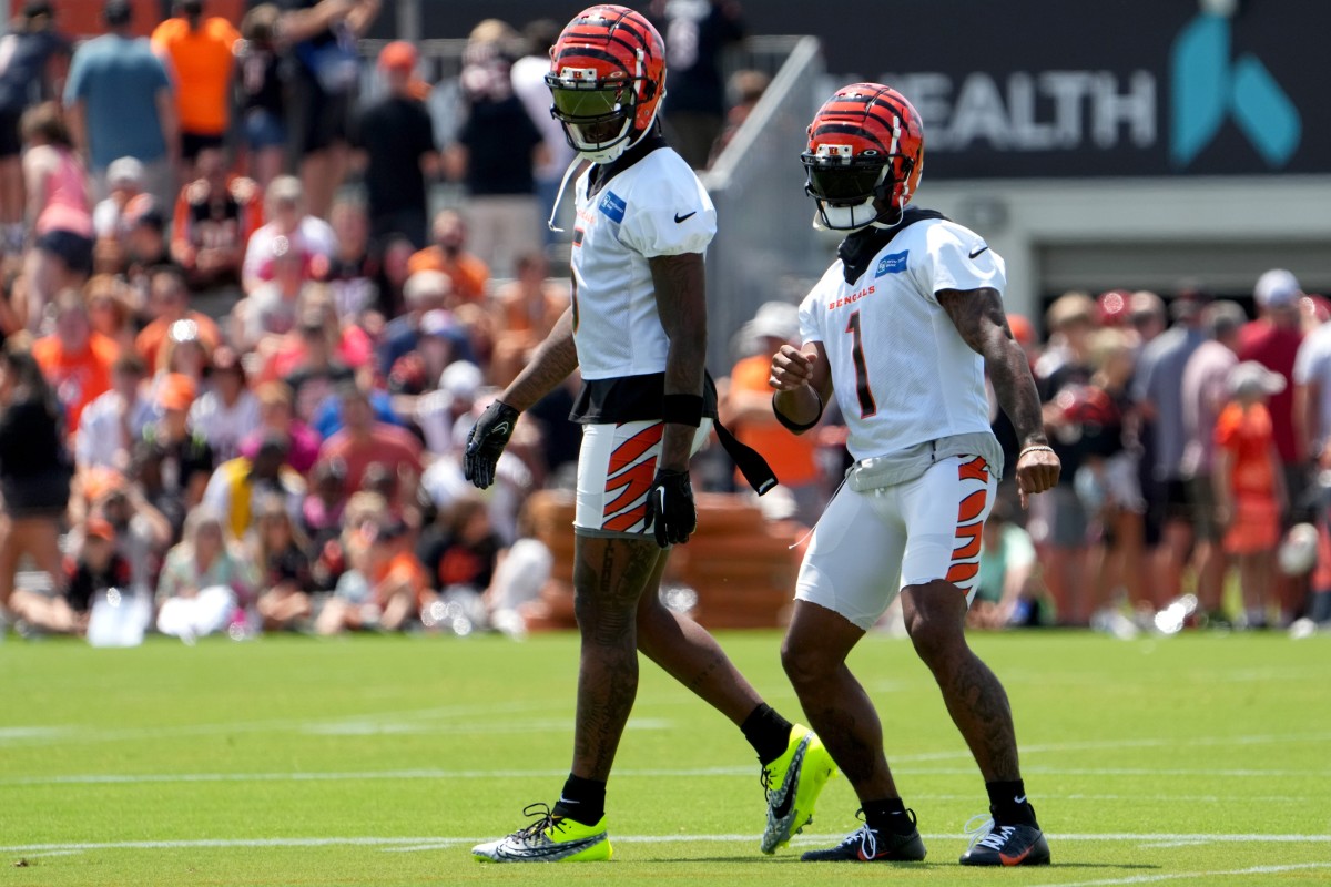 Cincinnati Bengals wide receiver Ja'Marr Chase (1) dances in front of Cincinnati Bengals wide receiver Tee Higgins (5) during NFL training camp practice, Monday, July 31, 2023, in Cincinnati.