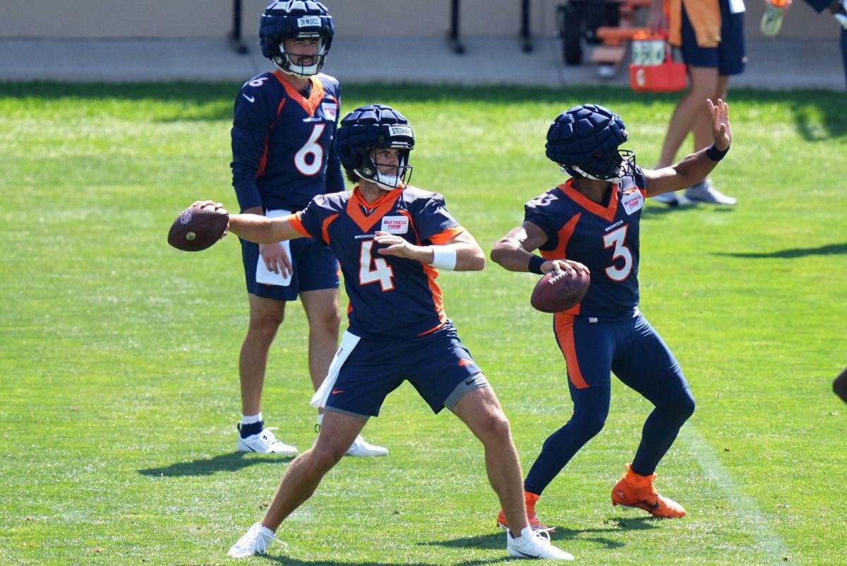 Denver Broncos quarterback Jarrett Stidham (4) and quarterback Russell Wilson (3) and quarterback Ben DiNucci (6) during drills at the Centura Health Training Center.