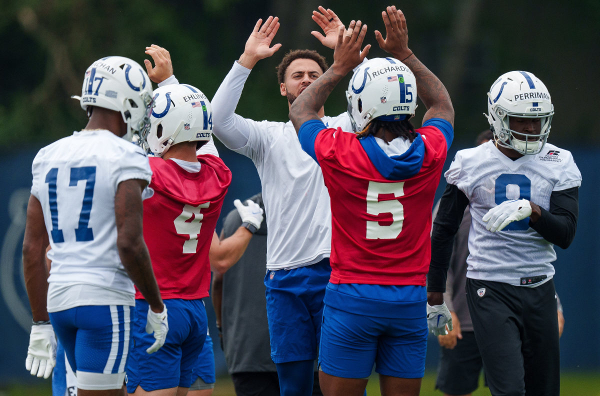 June 14, 2023; Indianapolis, IN, USA; Indianapolis Colts quarterback Anthony Richardson (5) gives a high-five Wednesday, June 14, 2023, to Colts wide receiver Michael Pittman Jr. (11) during mandatory minicamp at the Indiana Farm Bureau Football Center in Indianapolis. Mandatory Credit: Mykal McEldowney-USA TODAY Sports