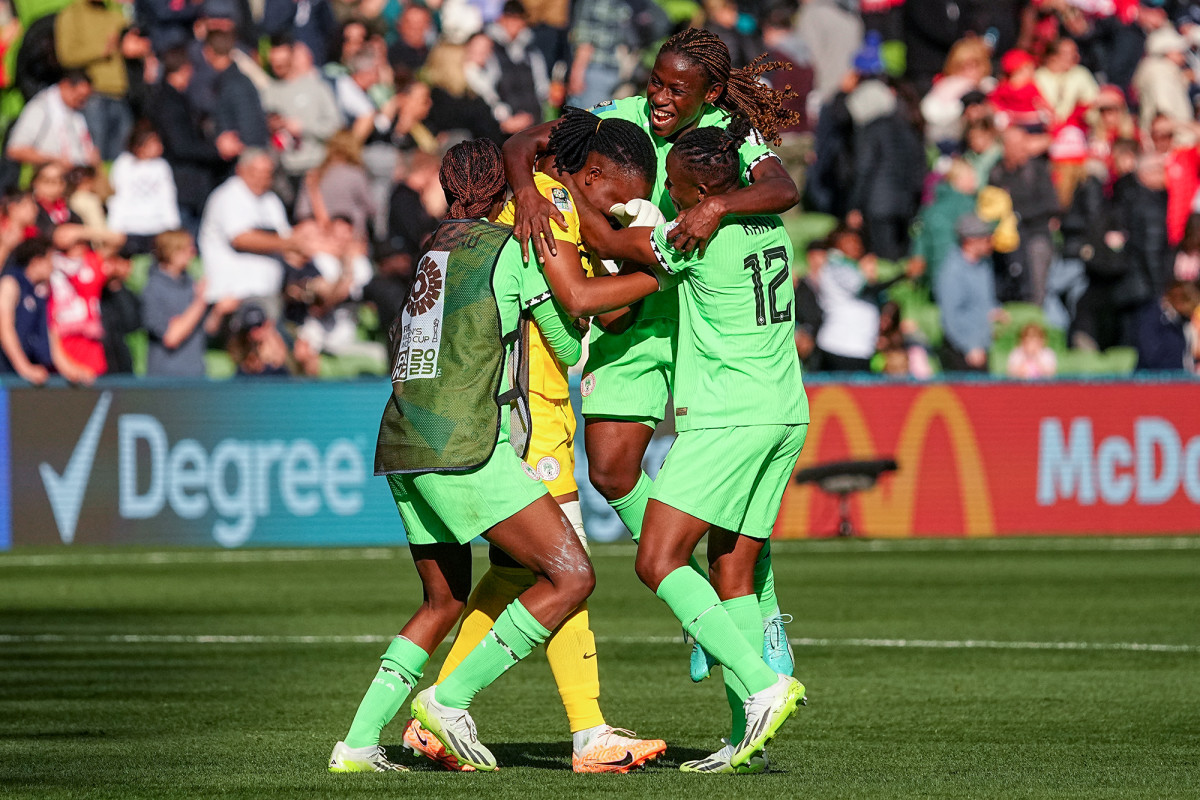 Nigeria players celebrate after finishing second in Group B at the Women's World Cup.