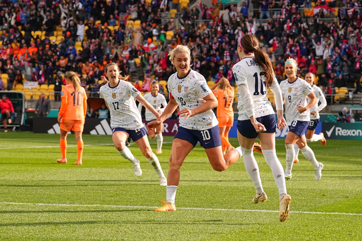 Lindsey Horan celebrates with Rose Lavelle after evening the score in the USWNT's game against the Netherlands at the Women's World Cup.