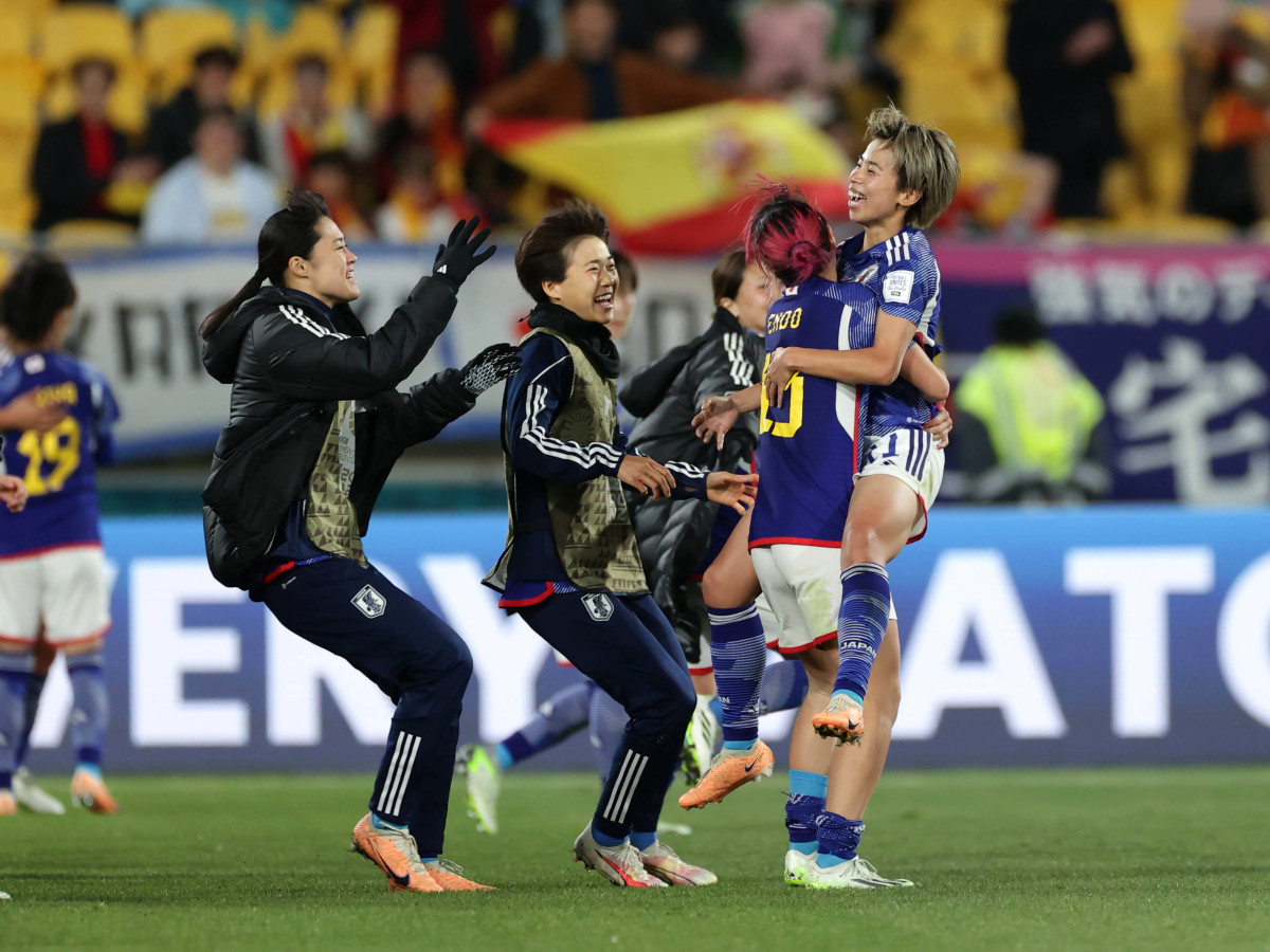Japan celebrates after beating Spain in group play at the Women's World Cup.