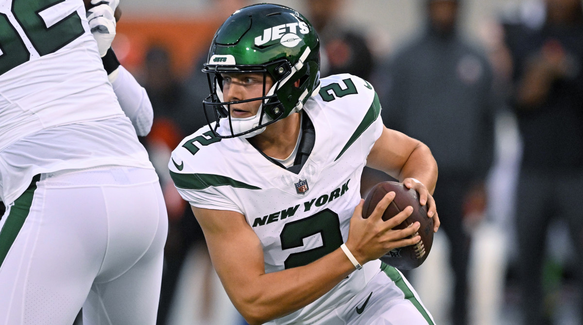 Jets quarterback Zach Wilson rolls out during the first half of the team’s Hall of Fame Game.