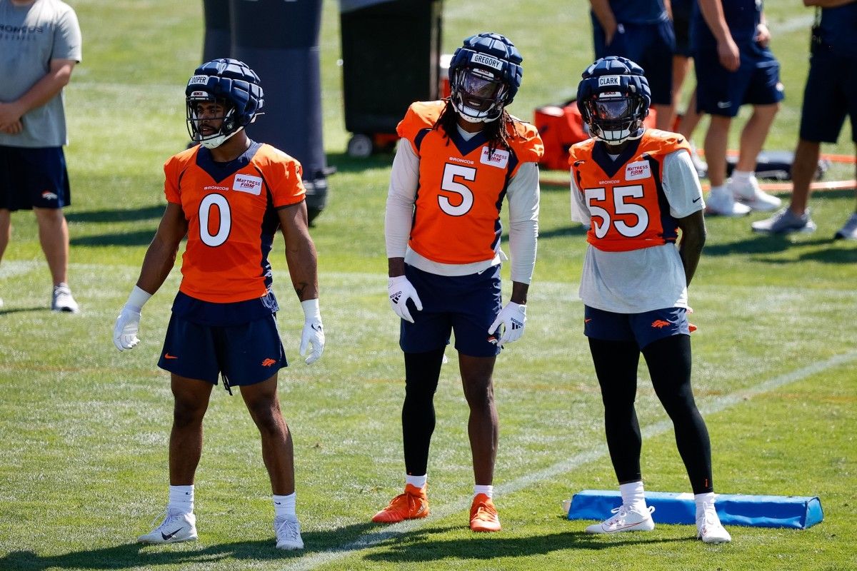 Denver Broncos linebacker Jonathon Cooper (0) and linebacker Randy Gregory (5) and center Kyle Fuller (55) during training camp at Centura Health Training Center.