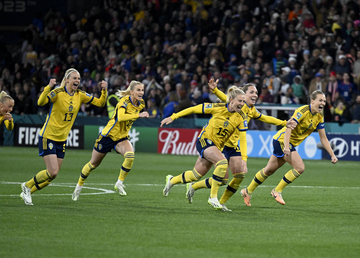 Sweden players pictured celebrating after beating the USA in a penalty shootout at the 2023 FIFA Women's World Cup