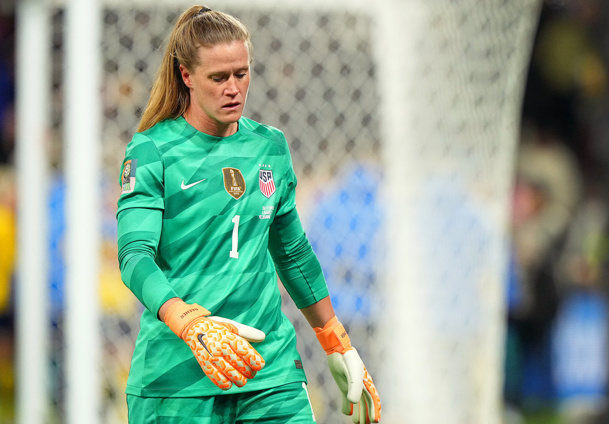 USWNT goalkeeper Alyssa Naeher looks down at the ground as Sweden wins at the Women's World Cup.