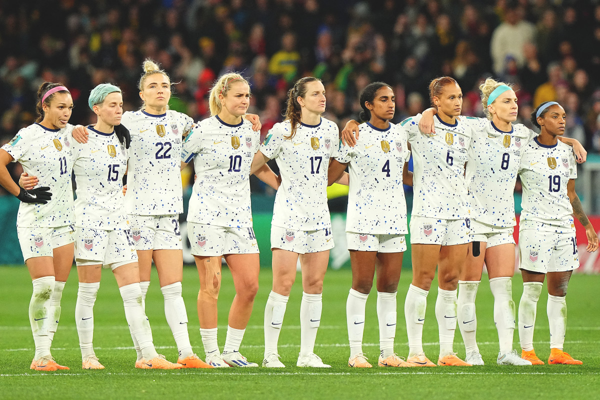 USWNT players link up while looking on during penalty kicks against Sweden at the Women's World Cup.