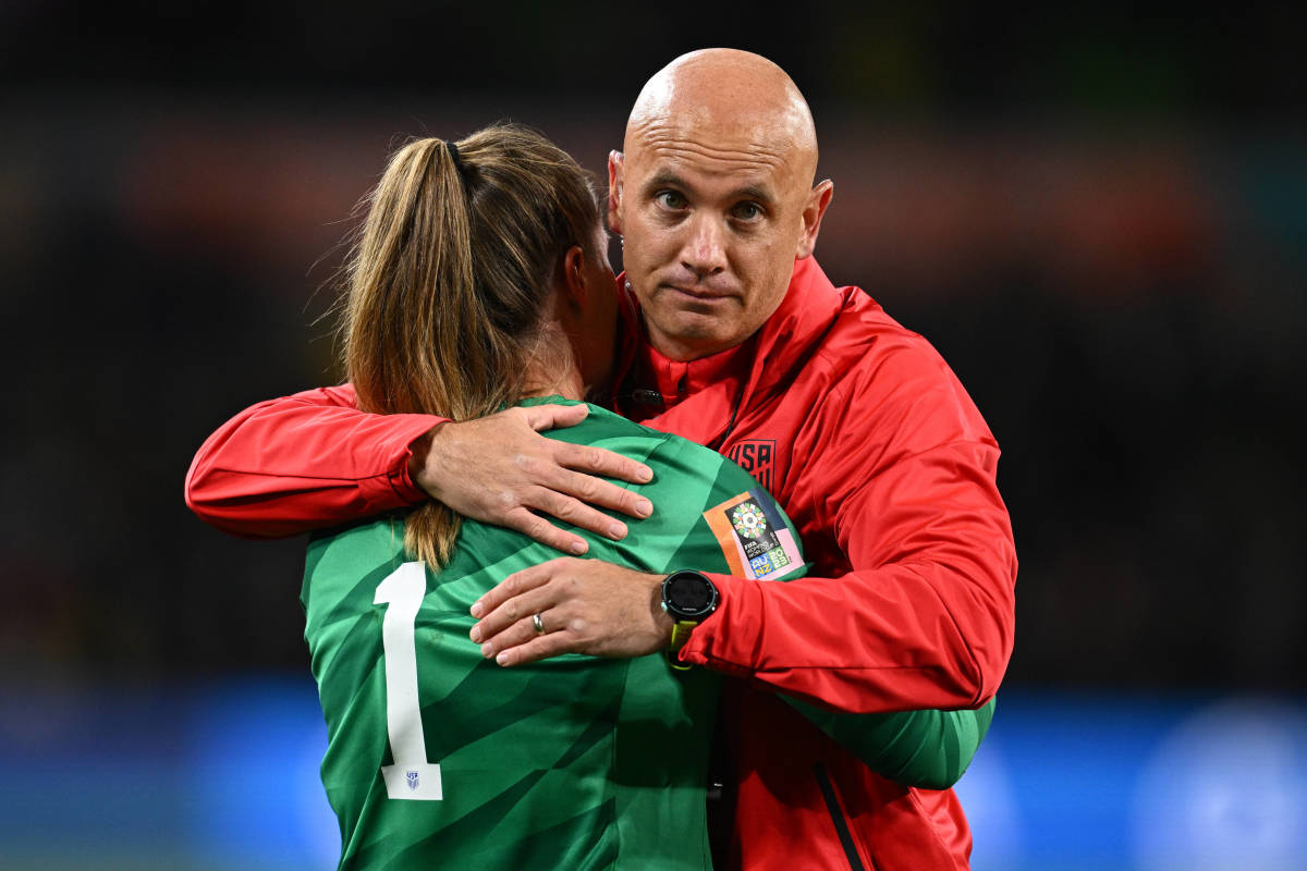 USA head coach Vlatko Andonovski pictured hugging goalkeeper Alyssa Naeher following the team's 5-4 penalty-shootout loss against Sweden at the 2023 FIFA Women's World Cup