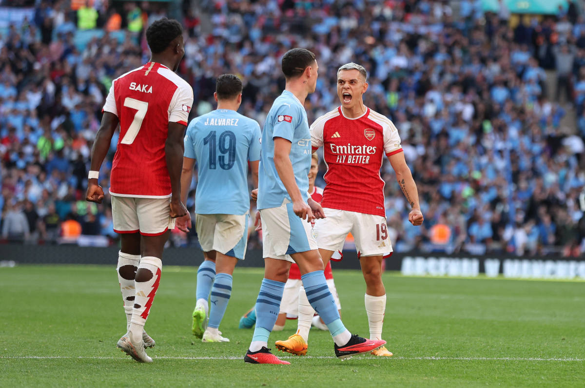 Arsenal's Leandro Trossard pictured (right) celebrating after scoring a late goal against Manchester City in the 2023 Community Shield game at Wembley