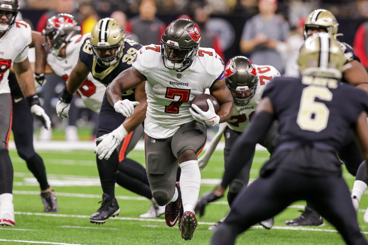 Tampa Bay Buccaneers running back Leonard Fournette (7) runs against New Orleans Saints defensive tackle Shy Tuttle (99) and safety Marcus Maye (6). Mandatory Credit: Stephen Lew-USA TODAY Sports